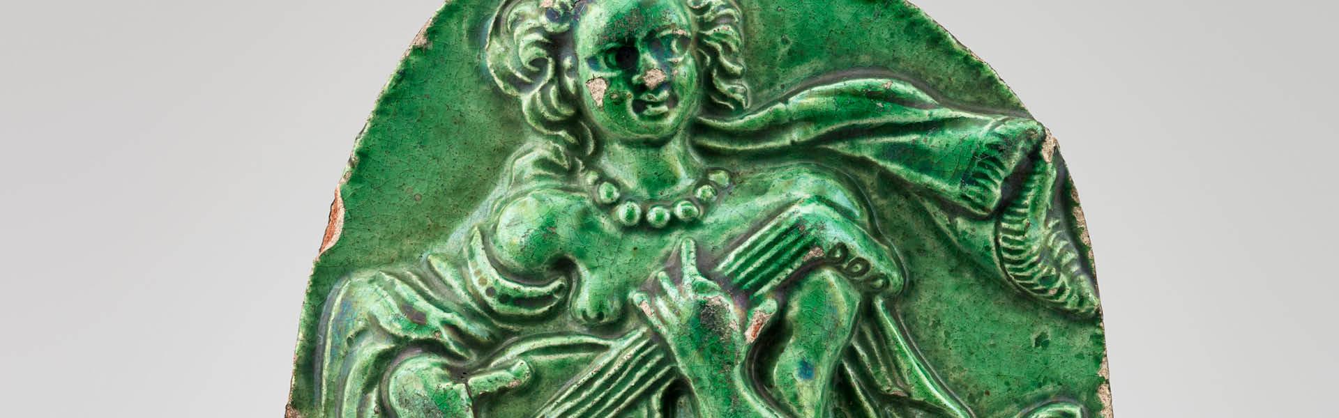 Carreau de poêle figurant la musique 